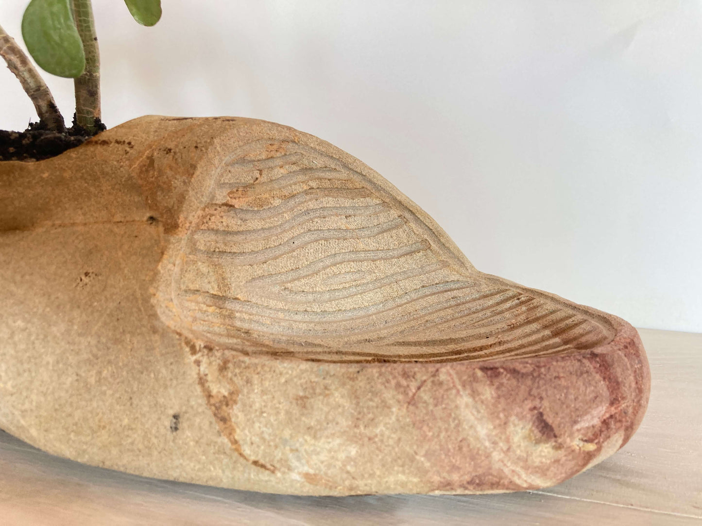 MACETA CON ESCULTURA.