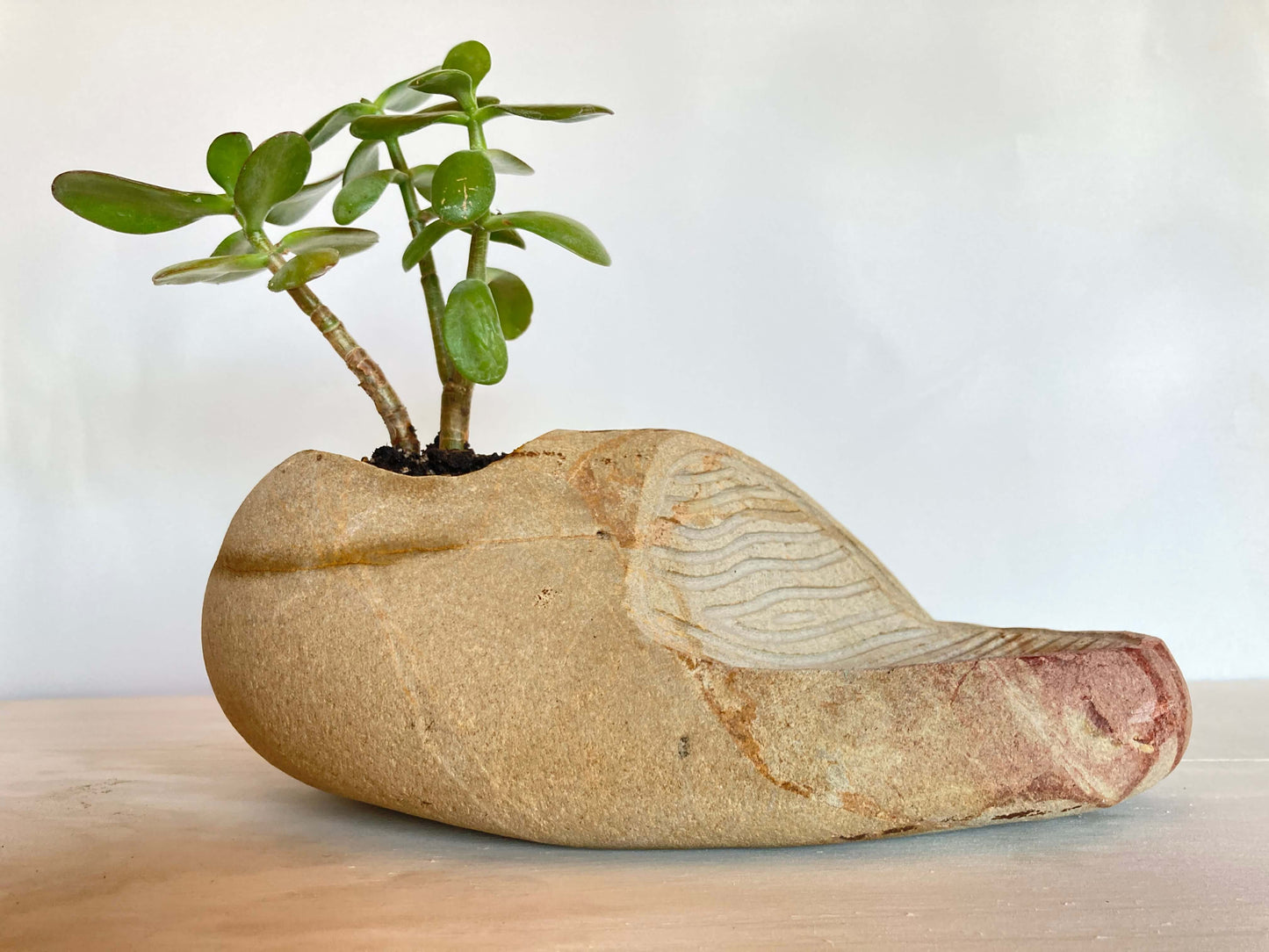 MACETA CON ESCULTURA.
